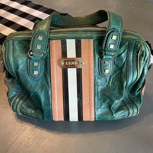 Gwen Stefani L.A.M.B. over the shoulder hand bag.